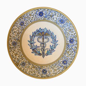 Piatto da parete in ceramica con caduceo in Faience, Italia, provincia di Deruta