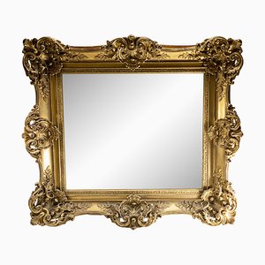 Espejo francés antiguo estilo Luis XV con marco dorado rococó