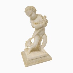 Figure en pierre d'albâtre sculptée Grand Tour du XIXe siècle représentant un garçon avec un chiot et un chien