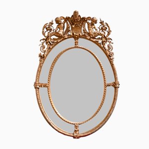 Specchio ovale Luigi XV della metà del XIX secolo con perline in legno e stucco dorato