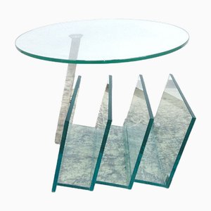 Mesa de centro moderna de vidrio con soporte para periódicos