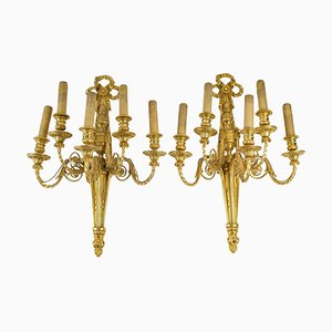 Lámparas de pared estilo Luis XVI de bronce chapado y dorado. Juego de 2