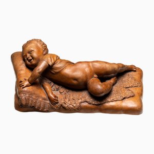 Reclining Infant in Terracotta by F. Sans