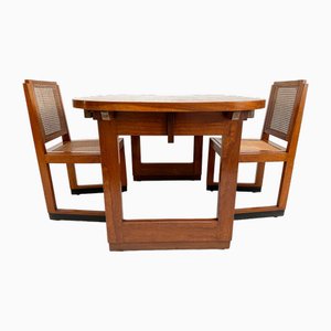 Mesa de comedor escolar extensible Art Déco y sillas de teca con asiento de malla, años 30. Juego de 3