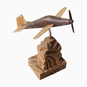Avión a hélice Art Déco de madera tallada y metal, años 20