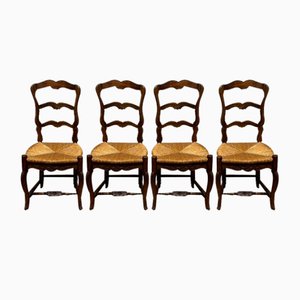 Sillas de comedor antiguas de nogal con asientos de paja, Francia, siglo XIX. Juego de 4
