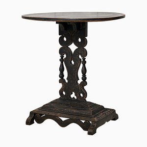 Swedish Center Table with Distressed Black Paint, Oval Top and Ornate Base