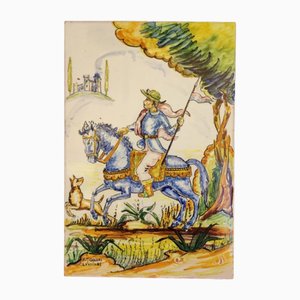 Cazador español vintage con un caballo y un perro pintados en un azulejo en Sevilla de Rafael Muñoz Chaves