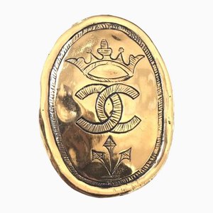 Vintage Gold Tone Large Brooch in Oval Coin Shape with CC Logo and Crown Embossed Motif from Chanel