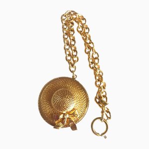 Collana vintage a catena dorata con cappello a cilindro di Chanel