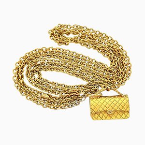 Collana lunga vintage dorata a tripla catena con Classic 2 di Chanel