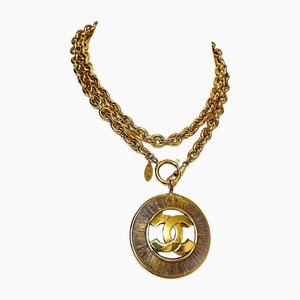 Vintage Golden Necklace with a Large Cutout Round CC Mark Pendant Top from Chanel