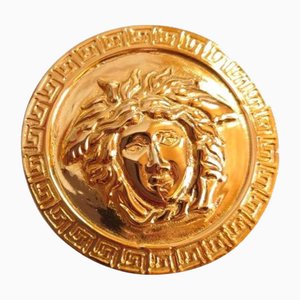 Spilla rotonda con motivo Medusa vintage color oro di Gianni Versace