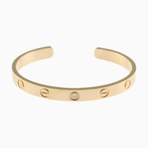 CARTIER Bracelet ouvert Love en or jaune 18k et diamants pour femme