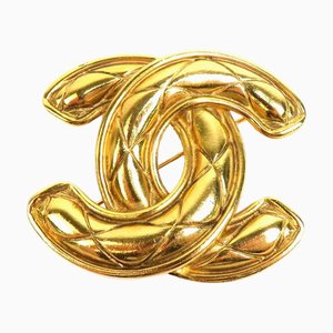 Broche de metal y oro de Chanel