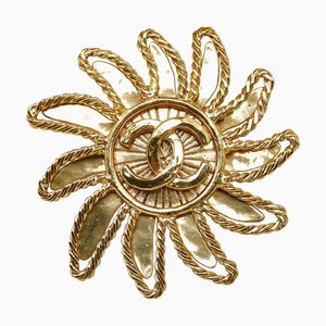 CHANEL Broche con motivo de sol bañado en oro Señoras