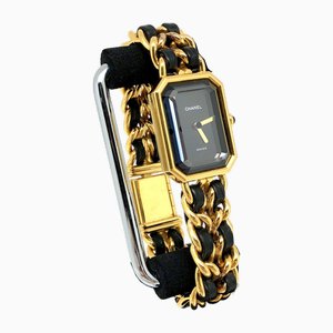 Orologio al quarzo color oro con quadrante nero di Chanel