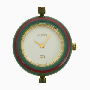 Cambiar bisel reloj 11/12 chapado en oro de fabricación suiza con pantalla analógica esfera blanca para mujer de Gucci