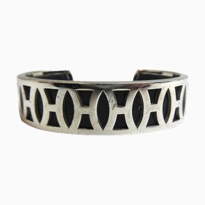 Bracciale rigido con logo HERMES H e accessori in metallo argentato nero