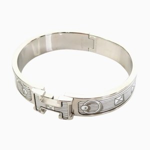 Bracelet jonc HERMES click crack métal/émail argent/blanc unisexe