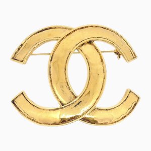 Broche CC en dorado de Chanel