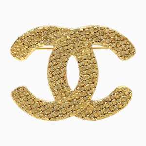Spilla CC intrecciata a forma di corpetto dorato di Chanel