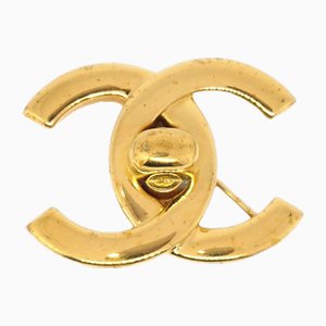 Broche CC Turnlock en dorado de Chanel