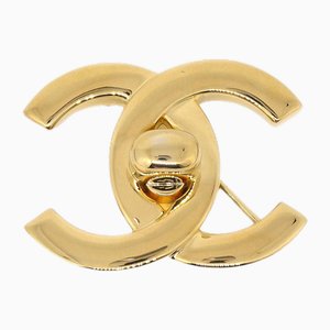 Spilla CC Turnlock in oro di Chanel