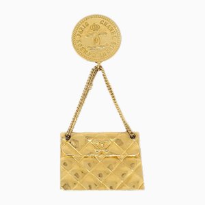 Broche para bolso en dorado de Chanel