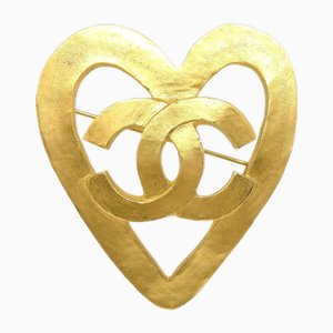 Broche de corazón dorado de Chanel