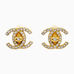 Aretes Turnlock de diamantes de imitación de oro de Chanel. Juego de 4