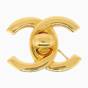 Broche Turnlock dorado de Chanel
