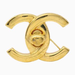 Broche Turnlock dorado de Chanel
