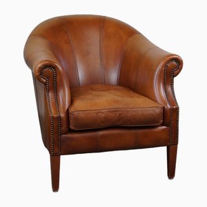 Club chair in pelle inglese color cognac