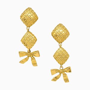Goldfarbene Ohrringe mit Schleife von Chanel, 2 . Set