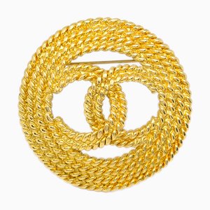 Spilla con medaglione in oro di Chanel