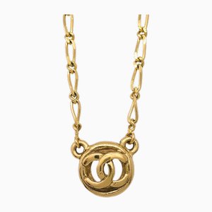 Collana con ciondolo a forma di medaglione in oro di Chanel
