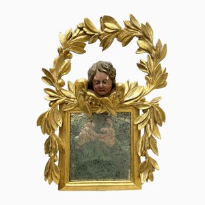 Espejo italiano de madera dorada tallada con guirnalda de laurel y Putto, 1800