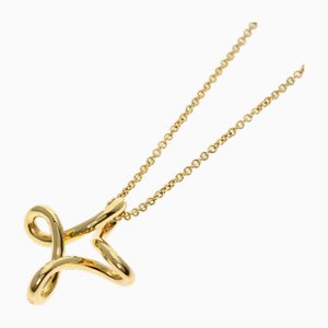 Collar con forma de cruz infinita en oro amarillo de 18 k de Tiffany & Co.