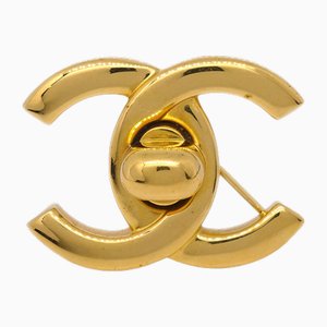 Kleine goldene Drehverschluss Brosche von Chanel