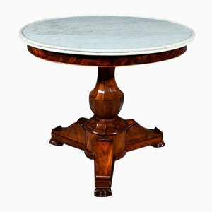 Tavolo con piedistallo in radica di mogano, inizio XIX secolo