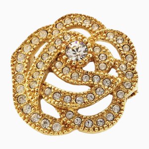Broche con motivo de flores de diamantes de imitación y dorado de Christian Dior