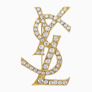 Broche de diamantes de imitación y oro de Yves Saint Laurent