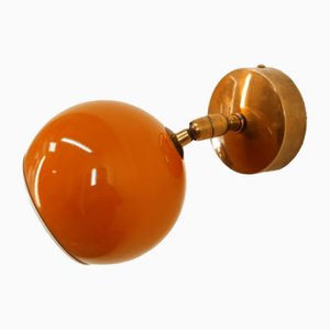 Aplique ajustable con cúpula de metal naranja