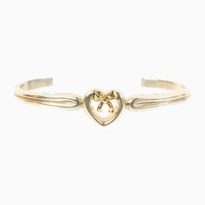 Bracciale rigido con fiocco a cuore in argento e oro di Tiffany & Co.