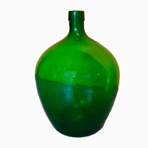 Botella de levadura modelo pequeña de vidrio verde, años 50