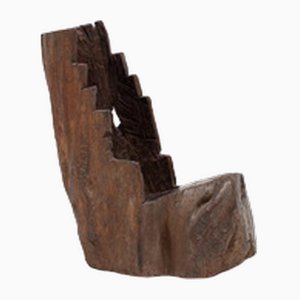 Silla chimenea rústica excavada en forma de tronco de árbol en Elm, Inglaterra, década de 1800