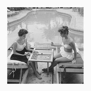 Slim Aarons, Backgammon by the Pool Essentials, Estate Stamped Photographic Print, 1959 / 2020s