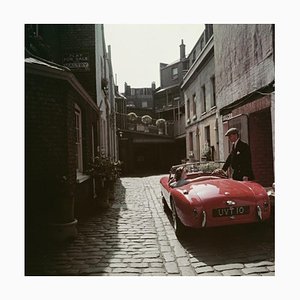 Slim Aarons, Sports Car Couple, Estate Stamped Photographic Print, 1955 / 2020s
