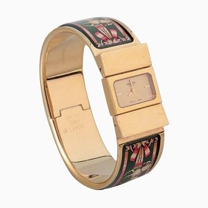 Reloj de pulsera de metal dorado y esmaltado de Hermes, años 70